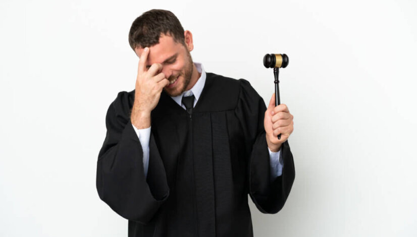 Judge caucasian man isolated on white background laughing