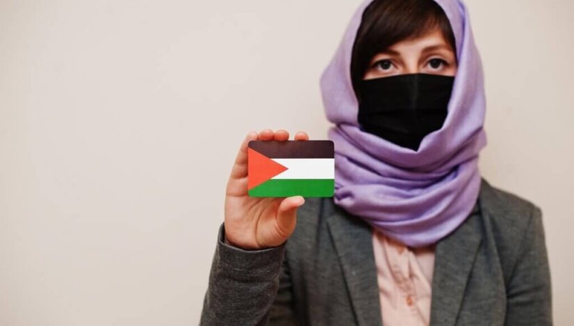 portrait-young-muslim-woman-wearing-formal-wear-protect-face-mask-hijab-head-scarf-hold-palestine-flag-card-against-isolated-background-coronavirus-country-concept_627829-11156