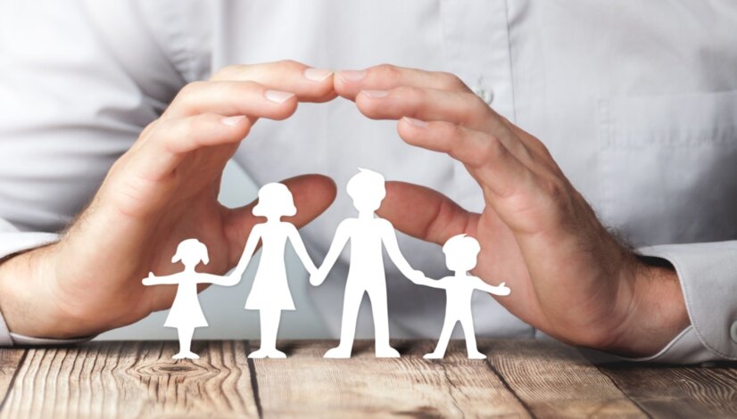 Protecting Hands Over Paper Family / Family Protection And Care Concept