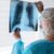 side-view-doctor-checking-radiography_23-2149601721